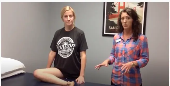 Standing pigeon pose to help stretch your lower back and hamstring during standing desk stretches